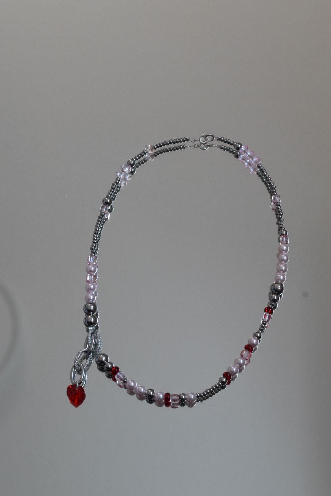 Perlenkette rosa rot mit Herzanhänger
